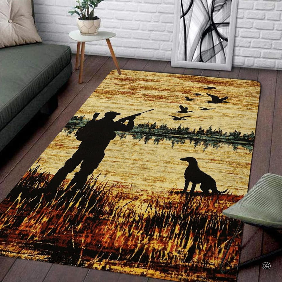 Silhouette of duck hunter and retriever dog in marsh reeds under golden sky on decorative area rug.