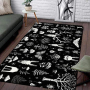 Modern living room floor staging showing the full flat perspective of the dark cottagecore skull rug - thumbnail image 2 of 8