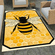 Honey bee rug hooking inspired area rug displaying centered bee artwork over golden honeycomb shapes. - thumbnail image 1 of 8