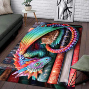 Colorful rainbow winged dragon gently sheltering a sleeping tabby kitten on a stack of vintage books area rug. - thumbnail image 4 of 5