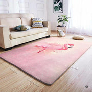 Living room seating arrangement with roaring fireplace and blush pink flamingo rug on light hardwood - thumbnail image 5 of 7