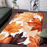 Modern living room sofa setting displaying the autumn maple leaves foliage area rug