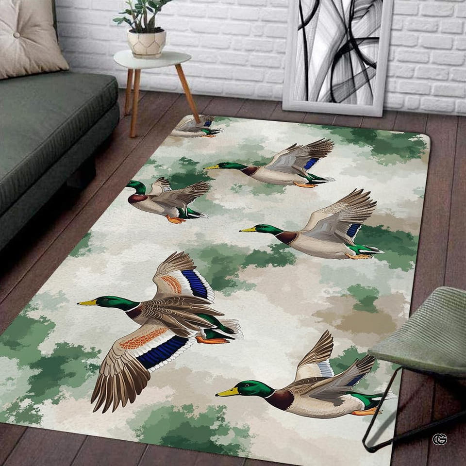 Mallard duck camo area rug displaying flying waterfowl on sage green backdrop.
