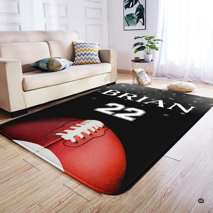 Football graphic rug styled beside contemporary lounge chairs to anchor a dynamic sports club floor plan. - thumbnail image 4 of 7