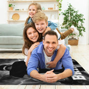 Sports fan cave layout displaying the thunderstorm football rug on hardwood flooring - thumbnail image 5 of 7