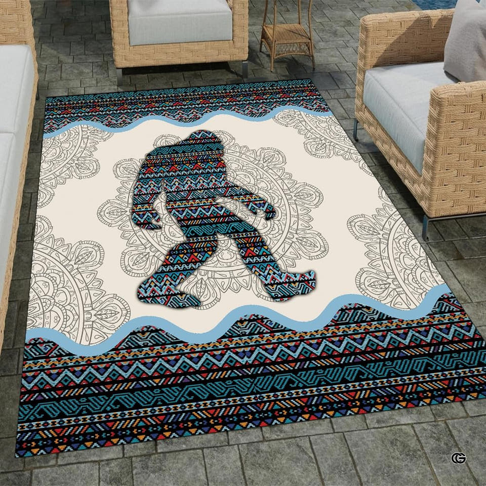 Southwestern area rugs featuring Bigfoot silhouette with tribal geometric patterns in living room layout.