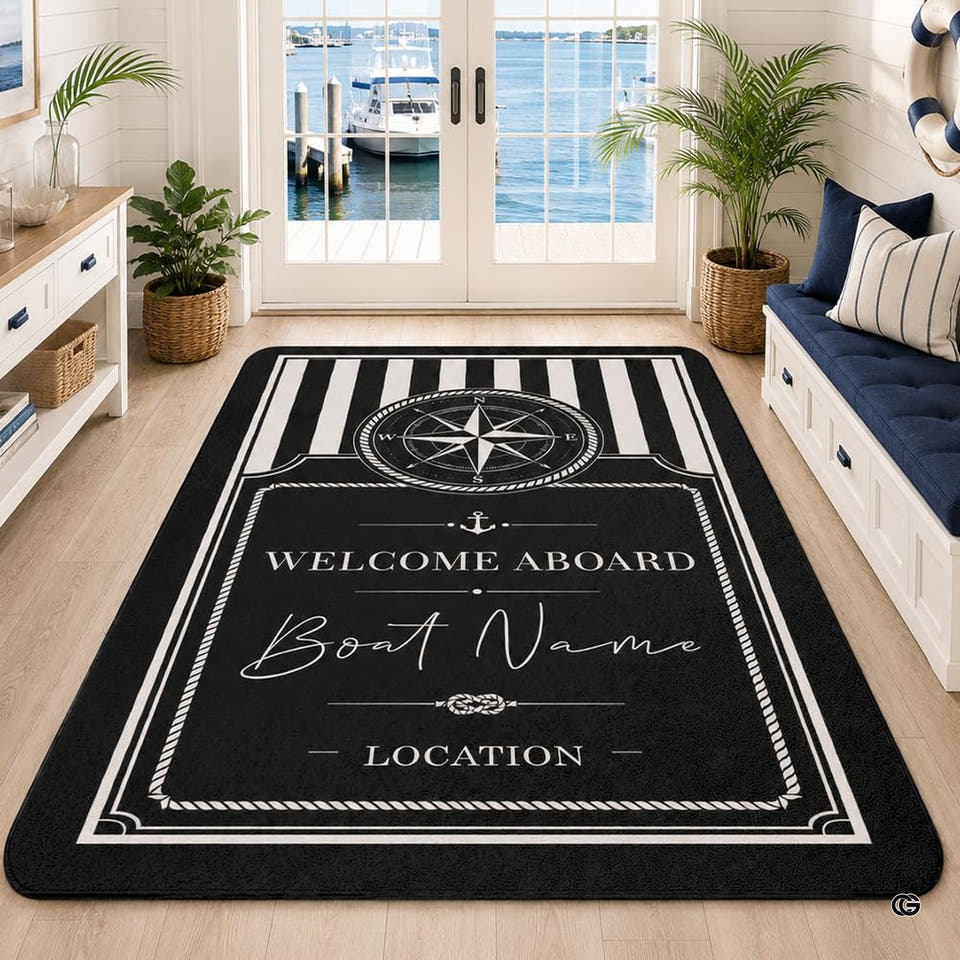 Black and white nautical compass area rug displayed on a light wood floor