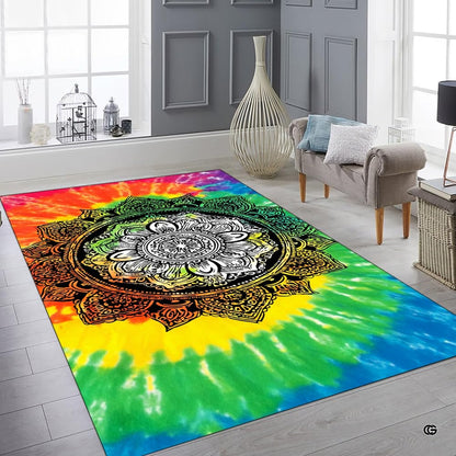 Top down overhead perspective of circular ornate black filigree mandala on a tie dye rug. - thumbnail image 6 of 8