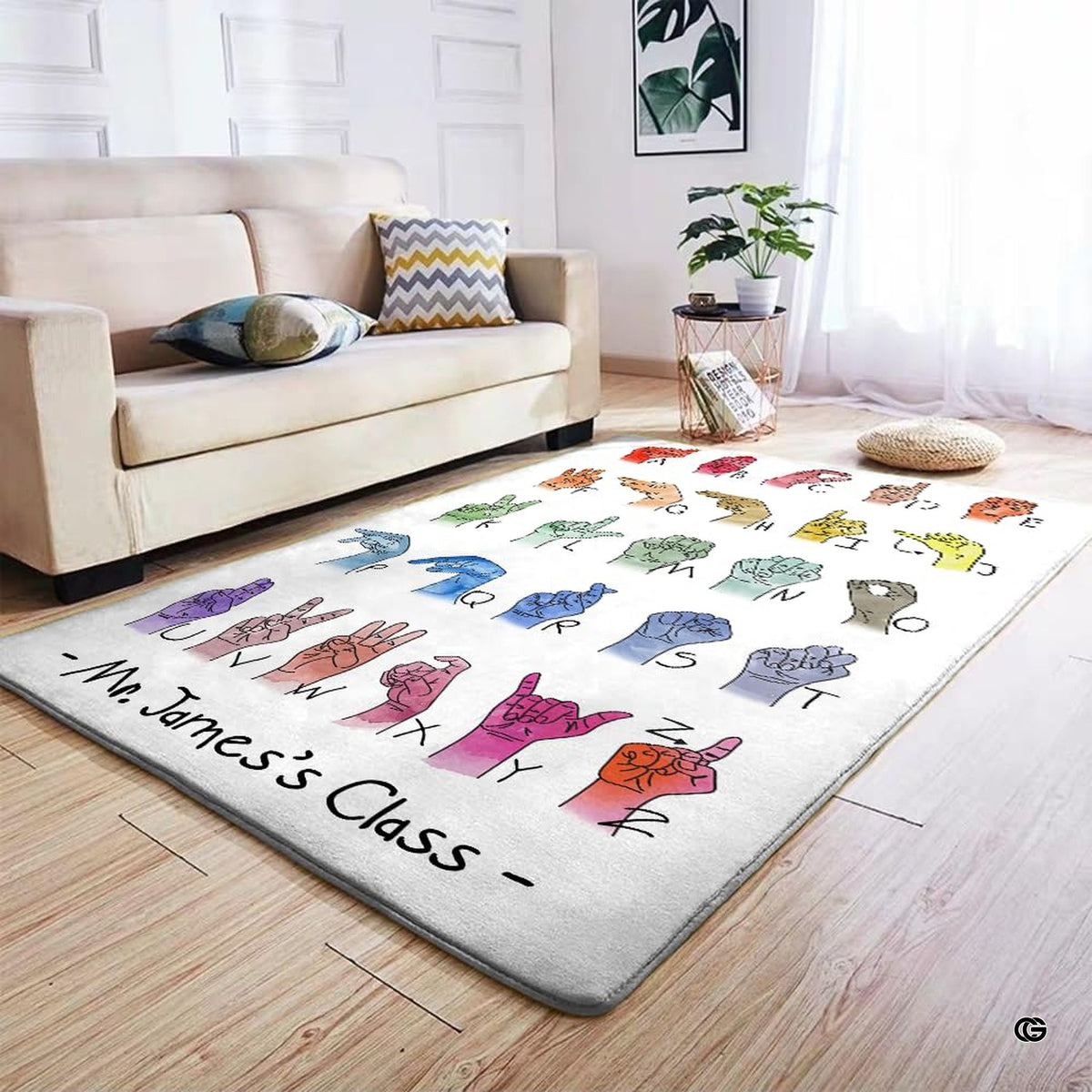 Detailed view of soft pile corner and watercolor fingerspelling print on classroom rug.