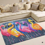 Rainbow colorful flamingo flock living room area rug in front of a sectional sofa