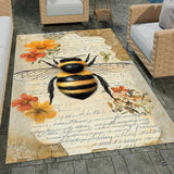 Stone patio setting featuring an antique botanical bee manuscript parchment area rug