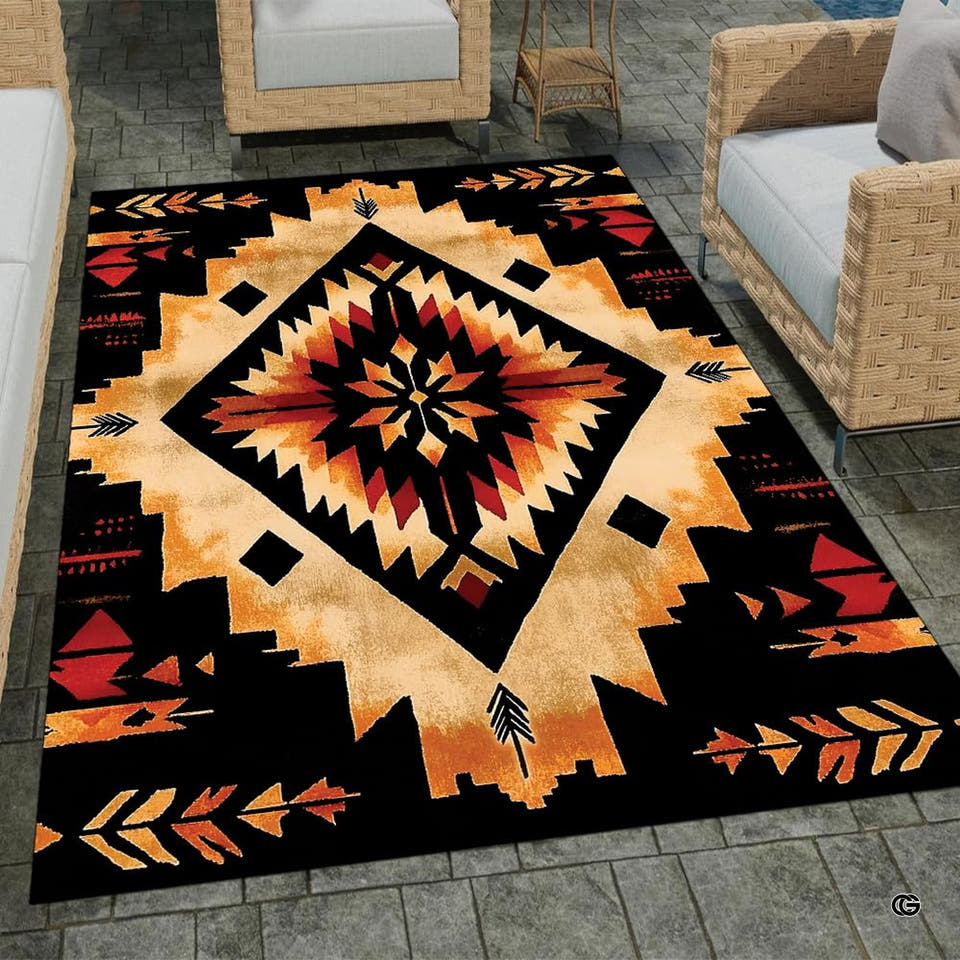 Southwestern geometric area rug featuring a radiant gold and terracotta starburst medallion on solid black.