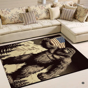 Close up of charcoal etched mountain peaks and red, white, and blue flag art on an area rug. - thumbnail image 4 of 5