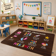Classroom setting with activity tables and bookshelves displaying the wood grain affirmations area rug - thumbnail image 1 of 8