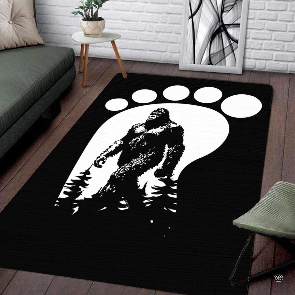 Living room setup with hardwood floor and white brick wall showcasing bigfoot footprint track area rug