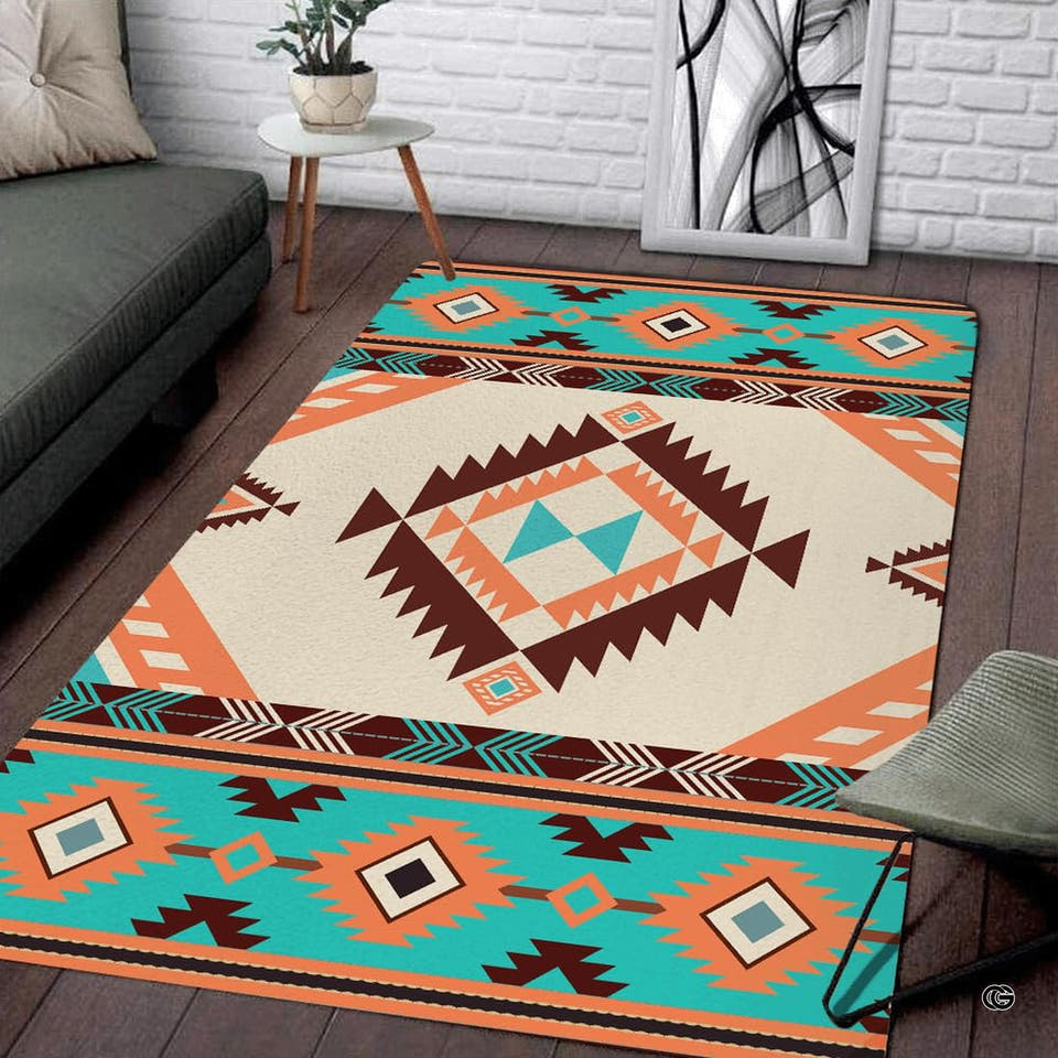 Southwestern tribal area rug with stepped diamond medallion in turquoise, terracotta, and ivory.