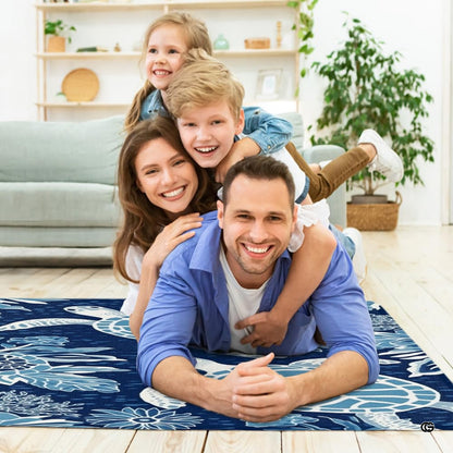 Angled view displaying the light blue and white coral patterns on deep navy background of the coastal area rug. - thumbnail image 5 of 7
