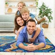 Overhead perspective of dynamic painterly brushstrokes depicting an octopus on an ocean creature rug. - thumbnail image 5 of 7