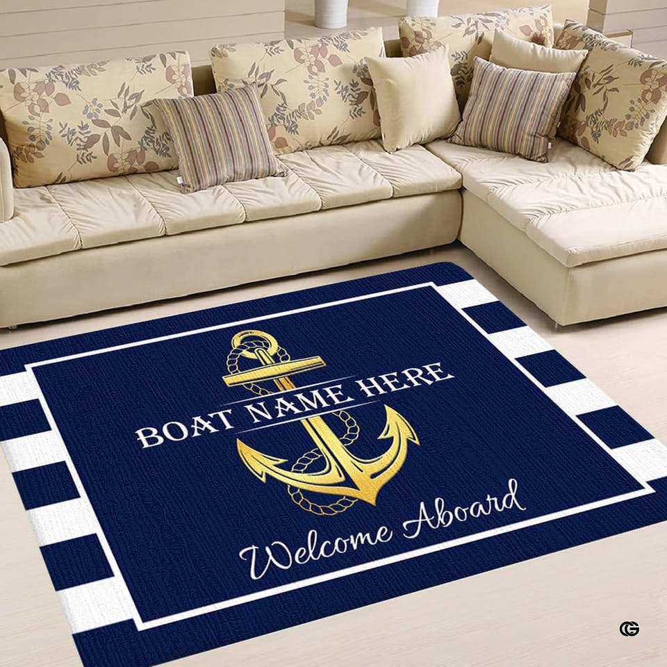 Nautical anchor Area Rug in deep navy blue with striped borders laid out in a bright living room.