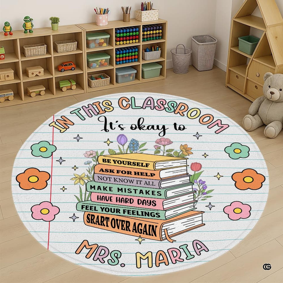 Overhead view of a round area rug with an illustrated book stack and wildflowers on notebook paper ground.