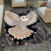 Barn owl rug showing an ornate flying barn owl with outstretched cream wings and botanical leaves on midnight blue. - thumbnail image 1 of 8