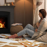 Sunlit living room fireplace setting displaying the modern giraffe area rug - thumbnail image 6 of 7