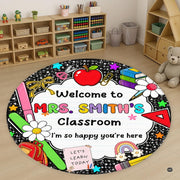 Circular school supply artwork with red apple, books, rainbow, and pencils on a dark chalkboard area rug. - thumbnail image 1 of 8