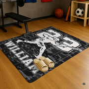 Top-down view of black and off-white lacrosse sports floor rug with number 23 athletic print. - thumbnail image 5 of 9