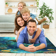 Close-up of radiant sunbeams and turquoise water details on a coastal area rug. - thumbnail image 5 of 7