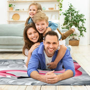 Living room arrangement showing the pink flamingo monochrome rug on wooden floor - thumbnail image 5 of 7