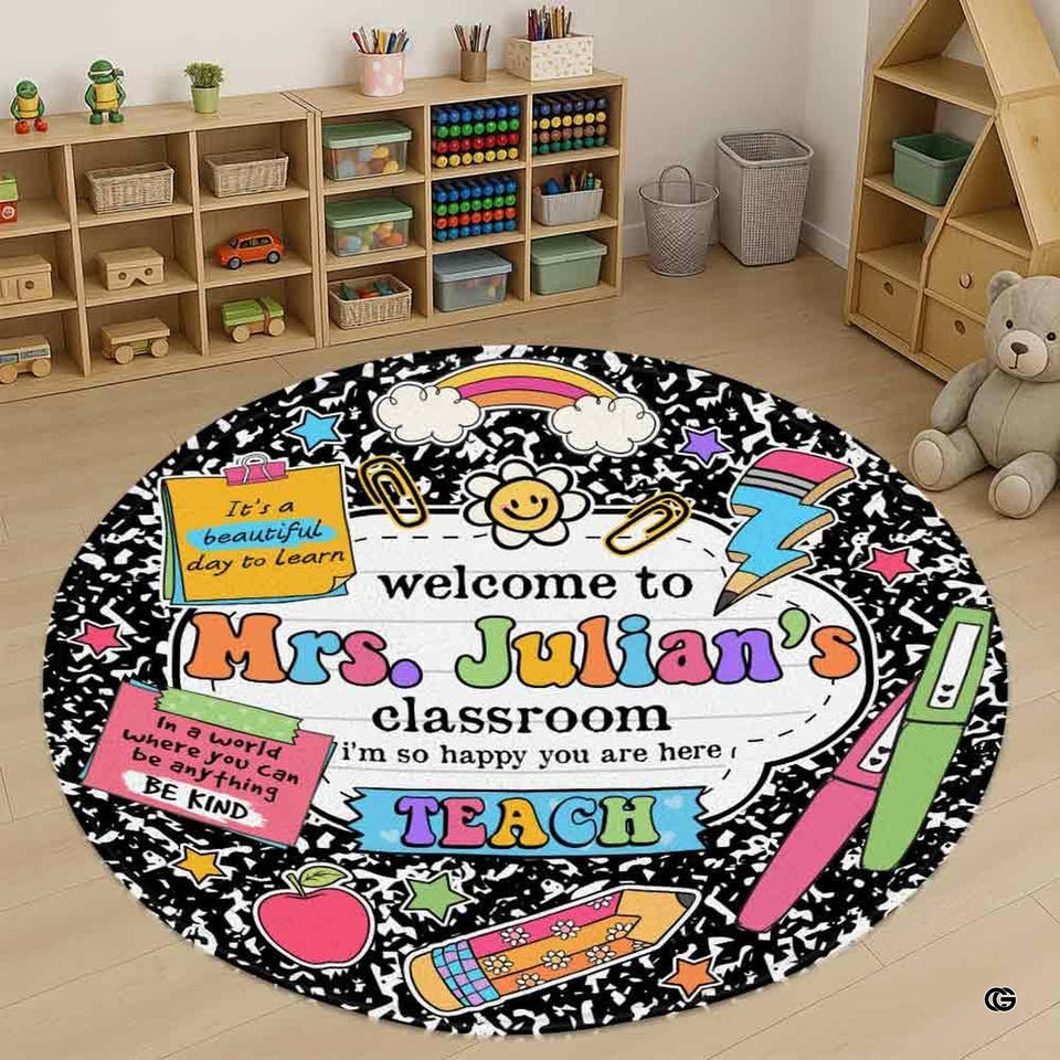 Overhead view of a round area rug with composition notebook marble pattern and stationery illustrations.