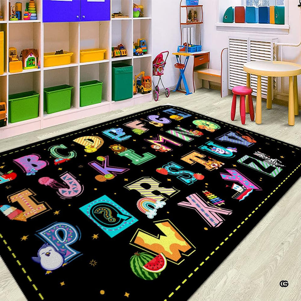 Kids alphabet area rug with colorful capital letters, animal artwork, and yellow border on starry black.