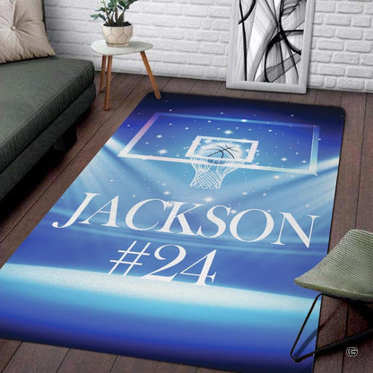 Basketball court area rug highlighting glowing hoop graphic and radiant arena lighting. - thumbnail image 1 of 7
