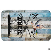 Angle display showing the marsh reed silhouettes, crossed shotguns, and weathered board art on a wood area rug. - thumbnail image 5 of 6