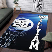 Modern living room floor setting featuring a dynamic soccer ball goal net sports area rug - thumbnail image 1 of 7