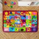 Alphabet preschool rug displaying multi-colored educational letter squares with whimsical cartoon artwork.