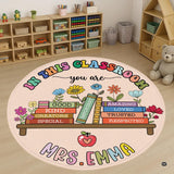 Circular welcome area rug displaying colorful books, daisies, and a red apple in retro pastel tones.