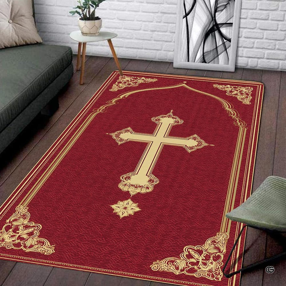 Crimson religious cross area rug displaying gilded Gothic cross and corner flourishes on dark wood floor.