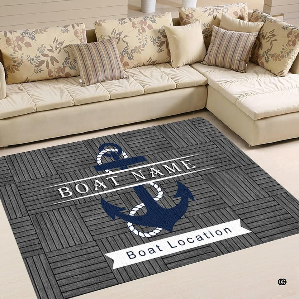 Living room setting with beige couch displaying the grey wood plank anchor area rug on tile flooring.