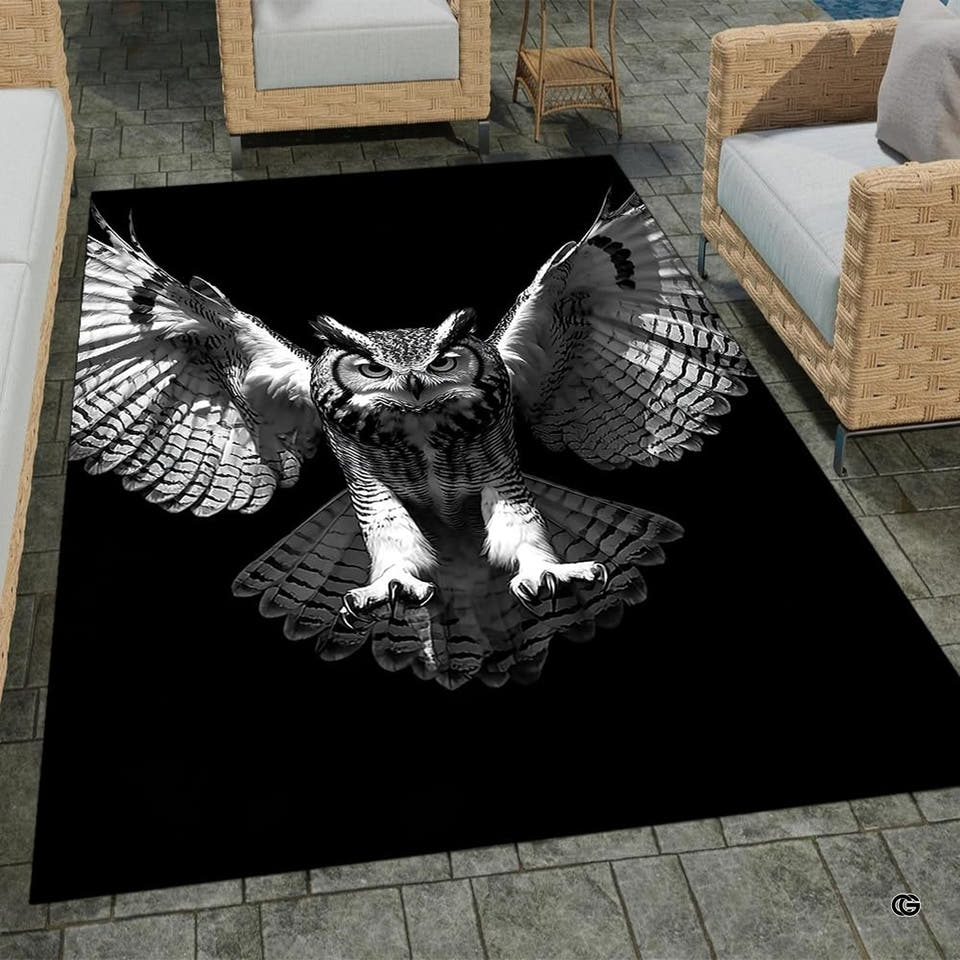 Swooping horned owl wings spread black and white living room area rug