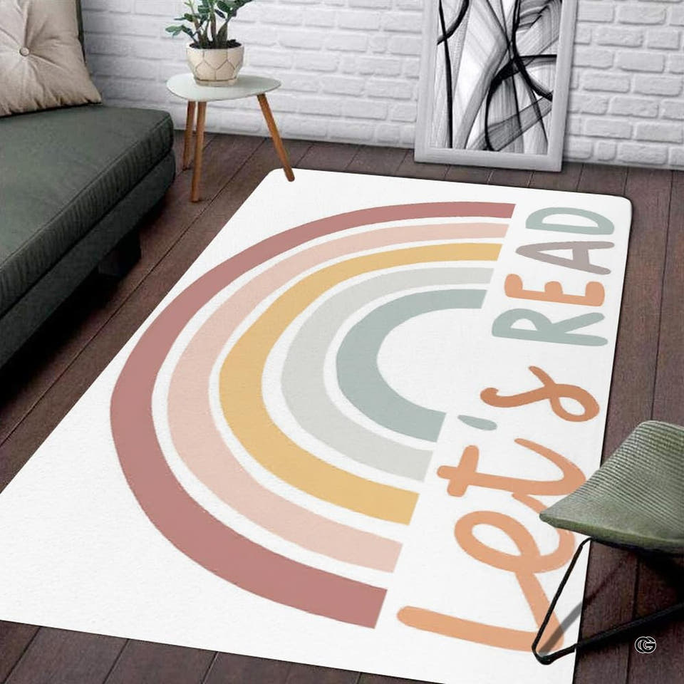 Pastel boho rainbow area rug placed on dark wood flooring in a living space.