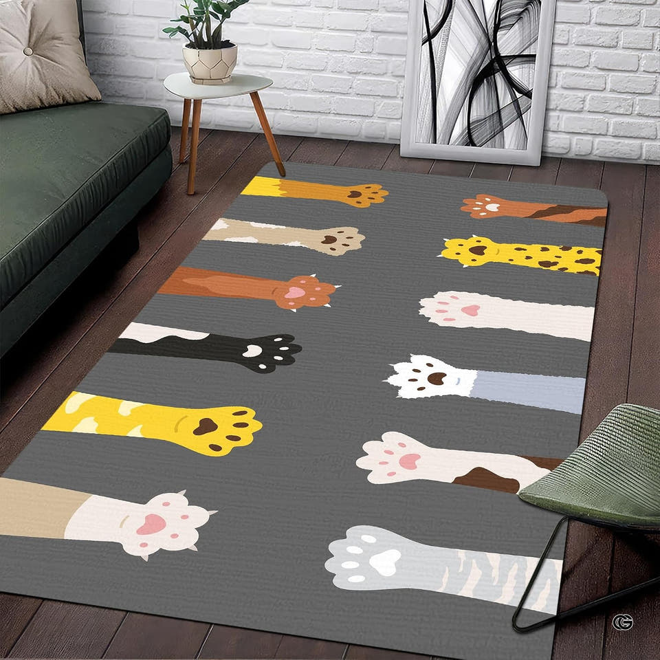 Cats paw area rug featuring cartoon cat legs reaching over a charcoal gray background.