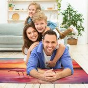 Close view of artistic painterly details showing flamingos and radiant horizon shades on a serene area rug. - thumbnail image 3 of 7