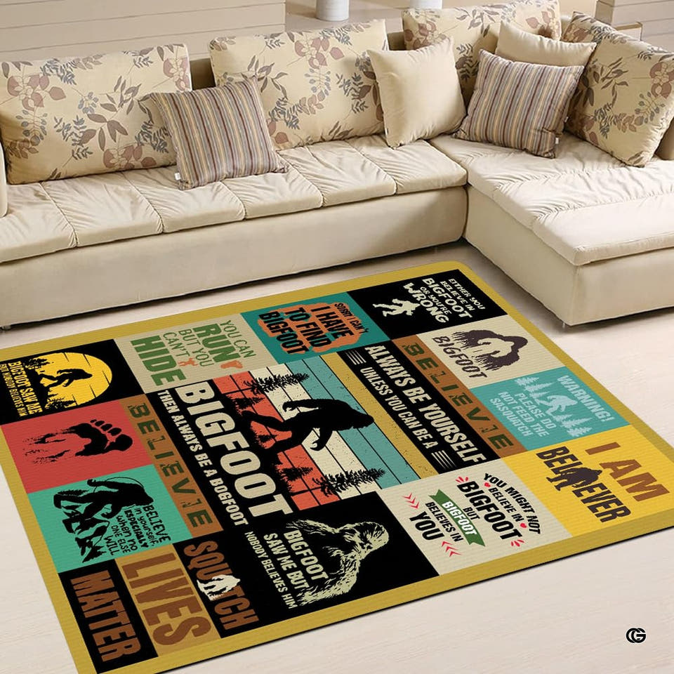 Cryptid folklore collage rectangular area rug positioned on tiled floor in front of a patterned sectional couch.
