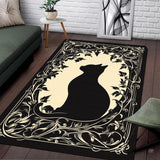 Art Nouveau black cat area rug centered on ivory cream background with ornate botanical filigree.