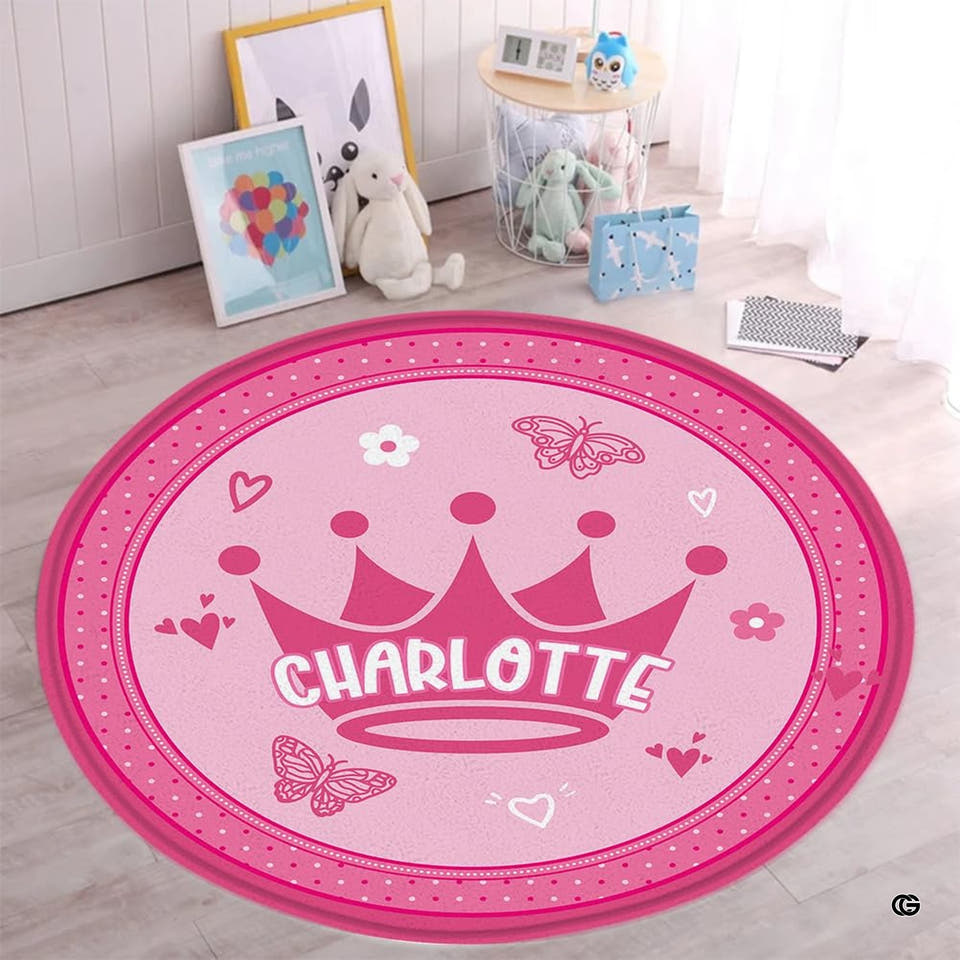 Round pink crown butterfly rug in a nursery