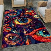 Stylized eye motif artwork complementing vintage floral rugs for living room styling concepts. - thumbnail image 7 of 8