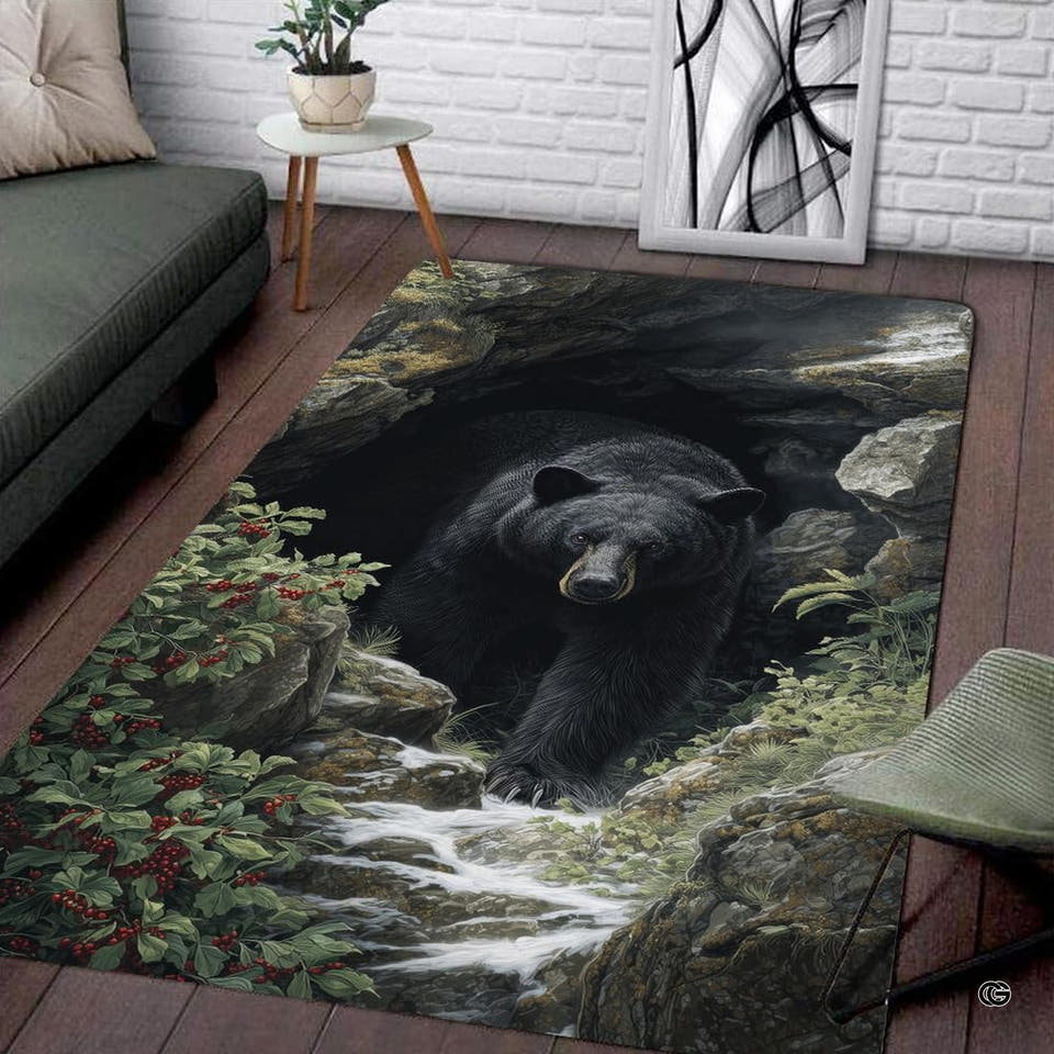 Area rug with a black bear emerging from a cave by a stream on wood floor