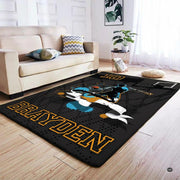 Overhead perspective of the basketball court area rug centering a contemporary living room seating arrangement. - thumbnail image 4 of 7