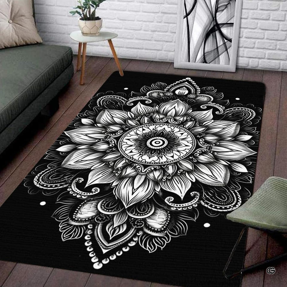 Black white rug with intricate circular floral mandala pattern centered on floor